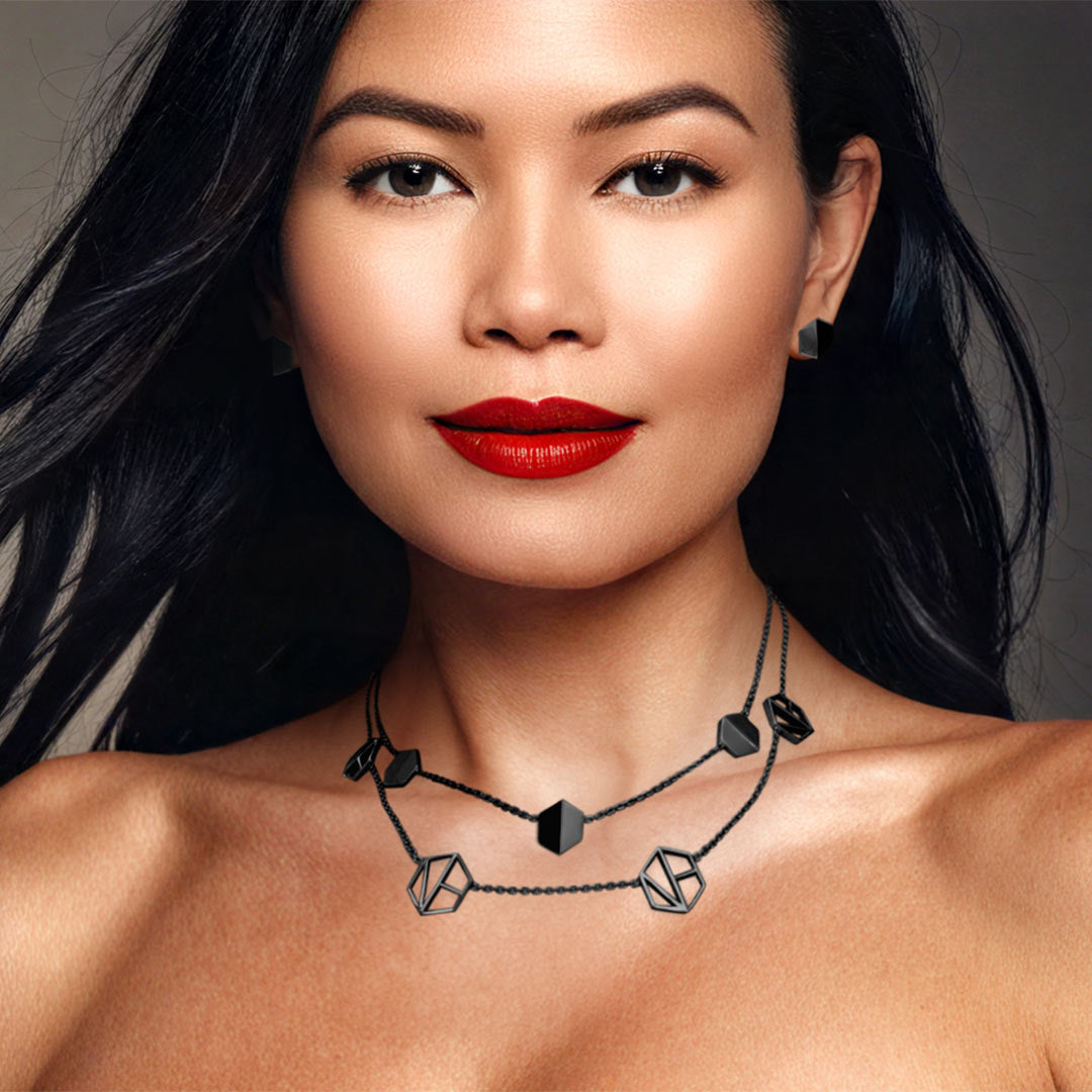 Naude Bourn's Know You stud earrings and Embrace You layered choker necklace in 18k black gold, showcasing an innovative jewelry design and superior quality.