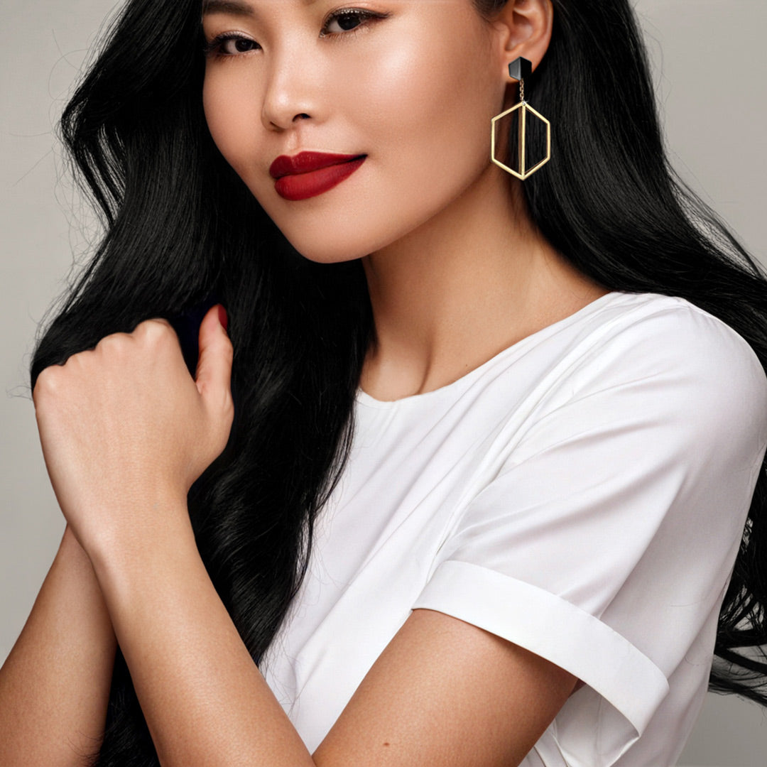 Naude Bourn's Illuminate You dangle earring accessory in yellow gold with Black Gold Know You Stud Earrings featuring a bold and striking design that makes a dramatic statement of elegance.