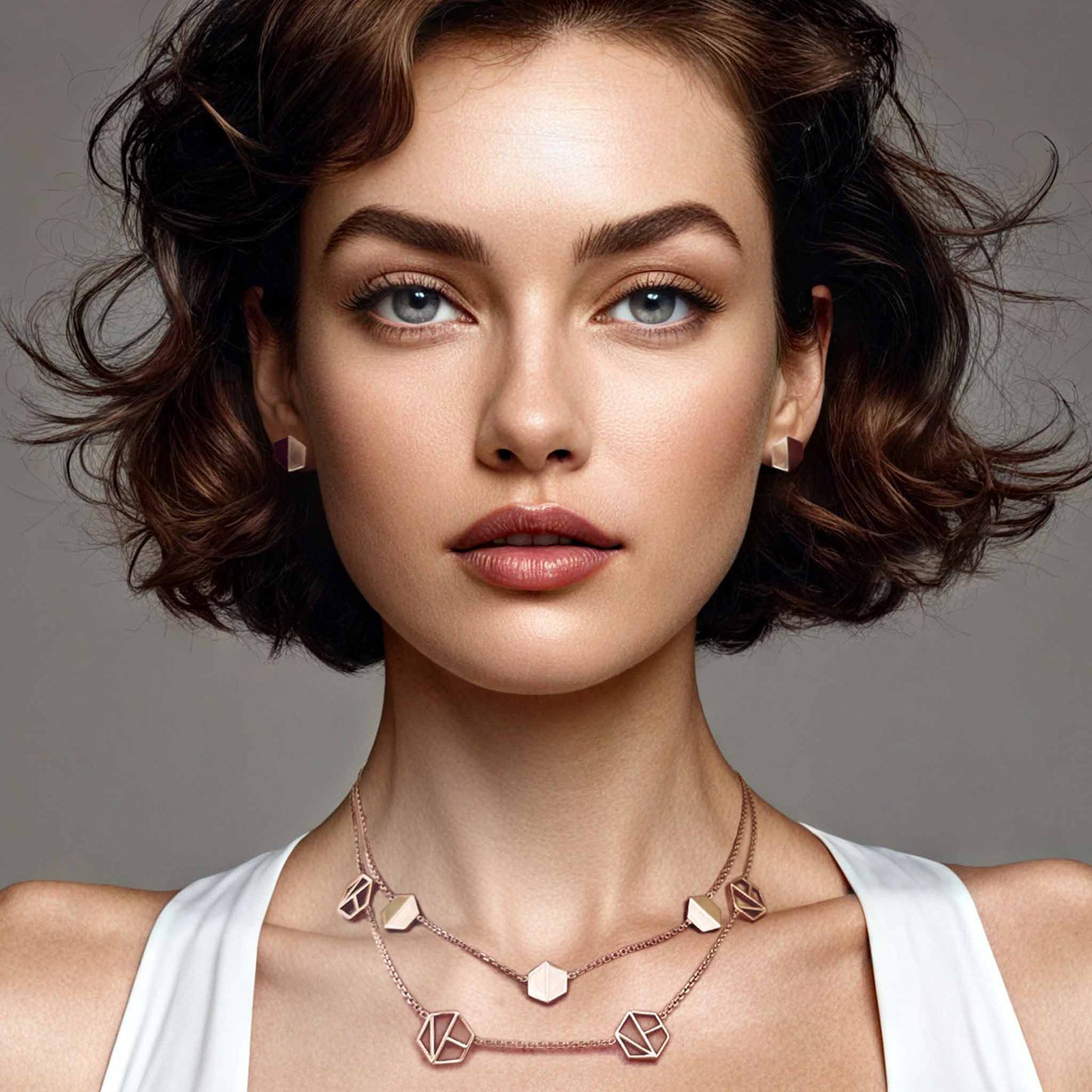 Naude Bourn's Know You stud earrings and Embrace You layered choker necklace in 18k rose gold, offering a remarkable jewelry design with unparalleled craftsmanship.