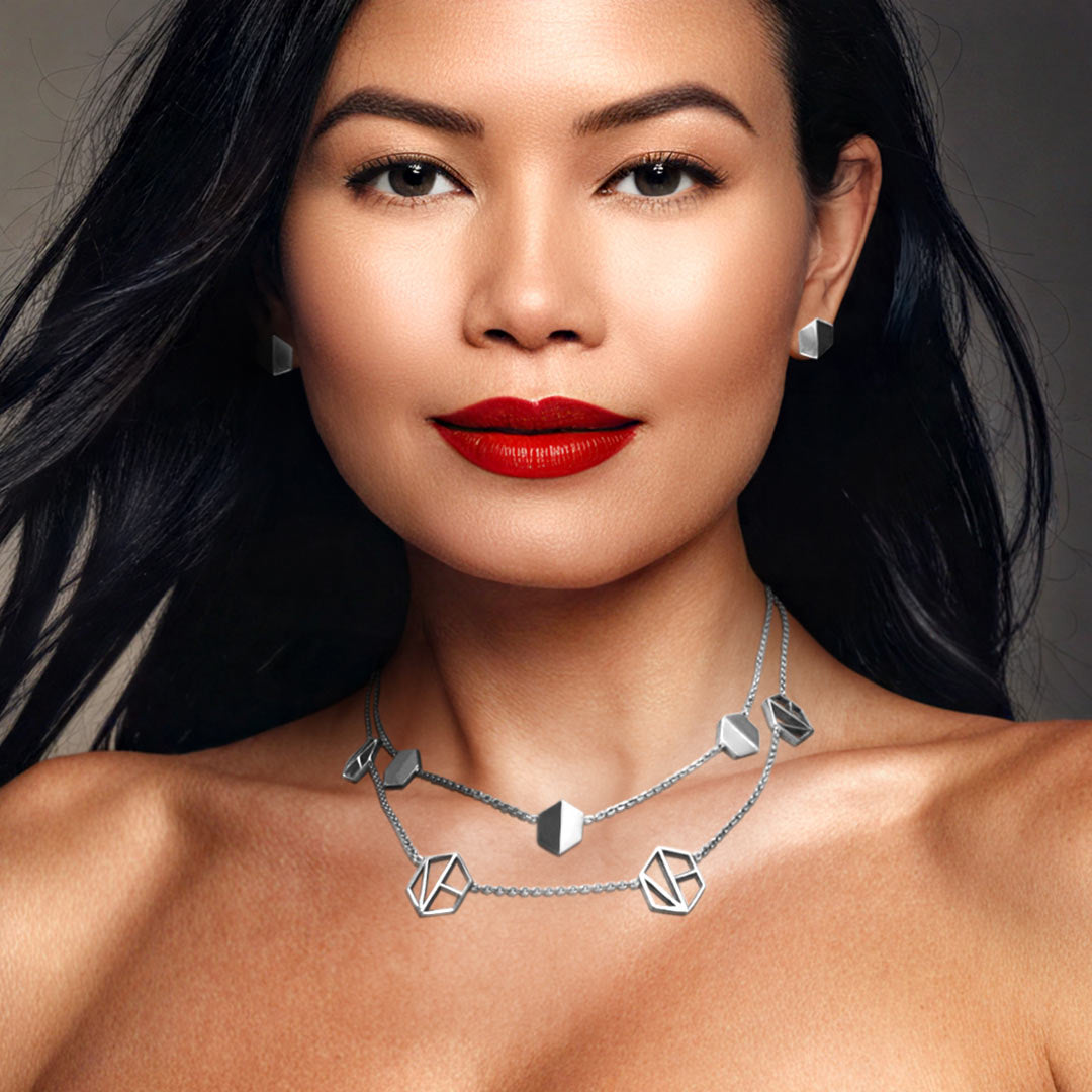 Naude Bourn's Know You stud earrings and Embrace You layered choker necklace in 18k white gold, combining a striking jewelry design with expert workmanship.