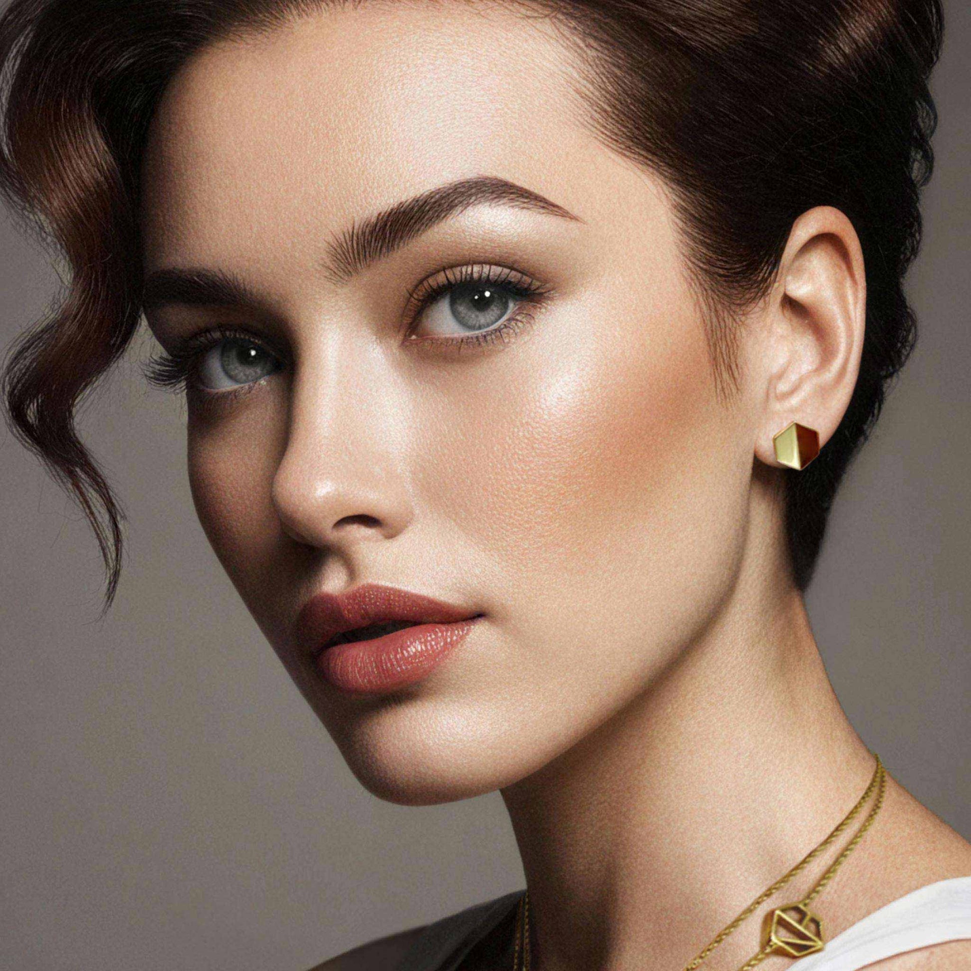 Naude Bourn's Know You stud earrings and Embrace You layered choker necklace in 18k yellow gold, showcasing unique jewelry design and craftsmanship.