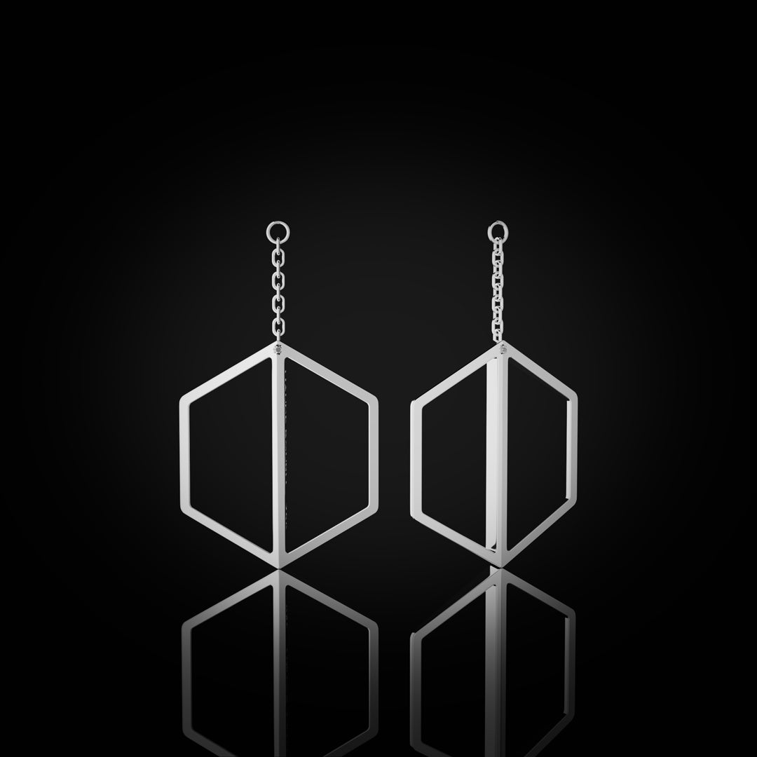 Naude Bourn's Illuminate You dangle earrings in white gold, offering a sleek and modern design that enhances sophistication and style.