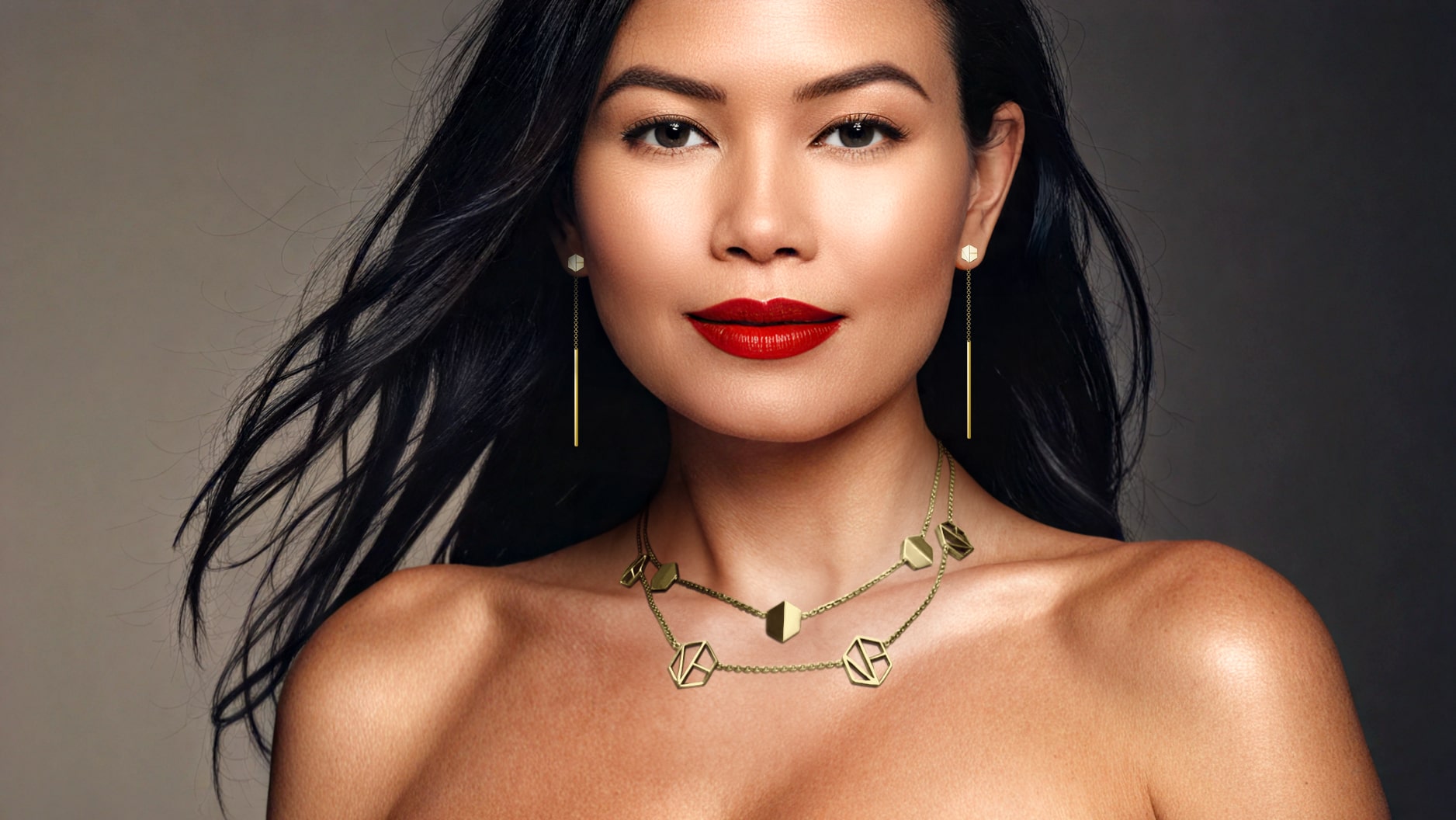 Beautiful asian model, strapless, wearing See You Threader Earrings in 18k Yellow Gold by Naude Bourn, featuring timeless elegance and modern craftsmanship.