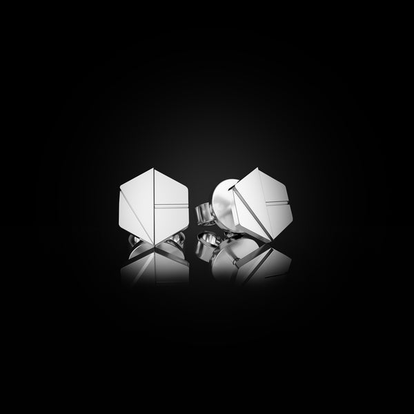 Hear You Mini Studs in Surge White Gold – 750 gold earrings for seers of the unseen, individually handcrafted by Naude Bourn. Sustainable gold jewelry, ethical jewelry, handcrafted artisan jewelry, fine jewelry, high-end jewelry, and ethical luxury. A visionary design from sustainable jewelry brands and a unique jewelry gift in white gold.