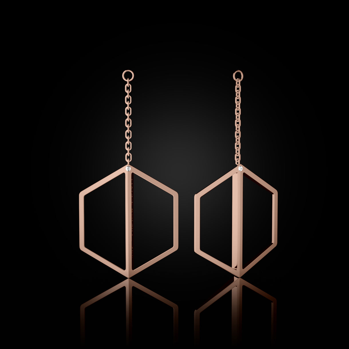 Illuminate You Dangles in Rebel Rose Gold – long earring accessory to pair with studs, expressing boldness and clarity by Naude Bourn. Sustainable gold jewelry, ethical jewelry, handcrafted artisan jewelry, fine jewelry, high-end jewelry, and ethical luxury. A striking design from sustainable jewelry brands and a unique jewelry gift in rose gold.
