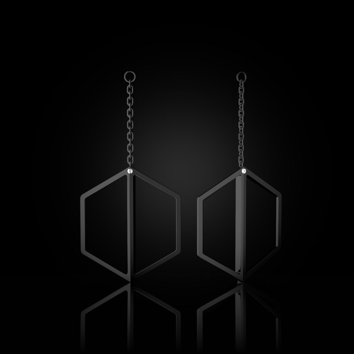 Illuminate You Dangles in Black Yellow 18k Gold – long earring accessory designed to pair with studs, handcrafted with purpose by Naude Bourn. Sustainable gold jewelry, ethical jewelry, handcrafted artisan jewelry, fine jewelry, high-end jewelry, and ethical luxury. A purposeful design from sustainable jewelry brands and a unique jewelry gift in black gold.